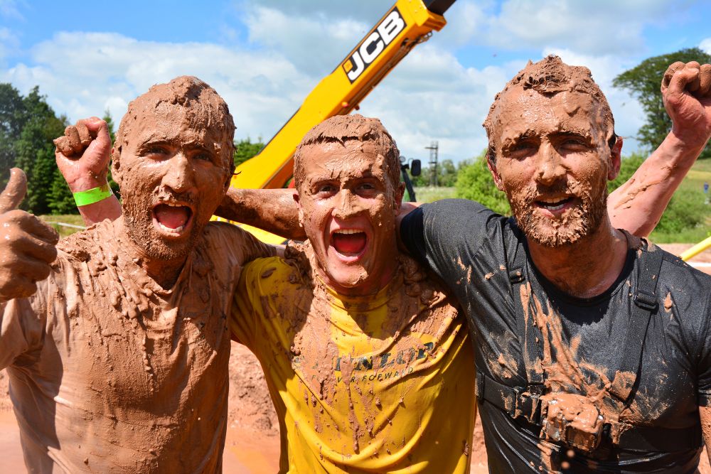 Record JCB mud run field delivers massive cash boost for NSPCC