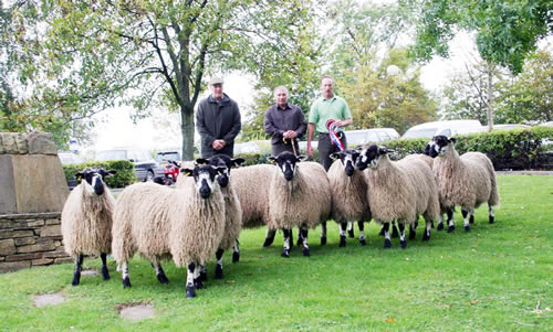 David Wilson, centre, of Masham Sheepdbreeders Association, joins 2010 Skipton Maham gimmer lamb champions, father and son Roland and David Verity