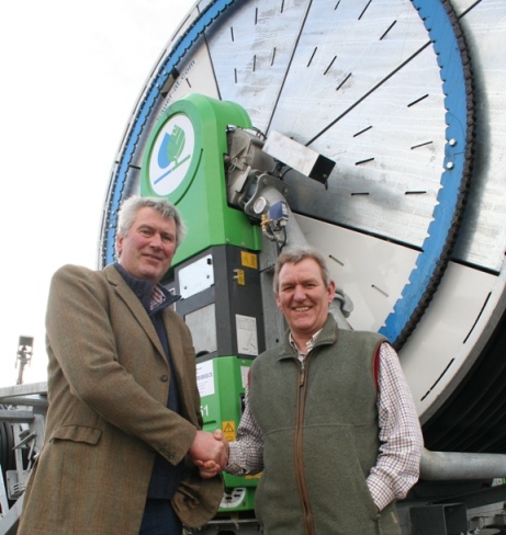 Potato grower Ian Mason (left) takes delivery of his 12 new Bauer Rainstar E51 irrigation reels from Tony Freezer of A J Freezer Water Services.