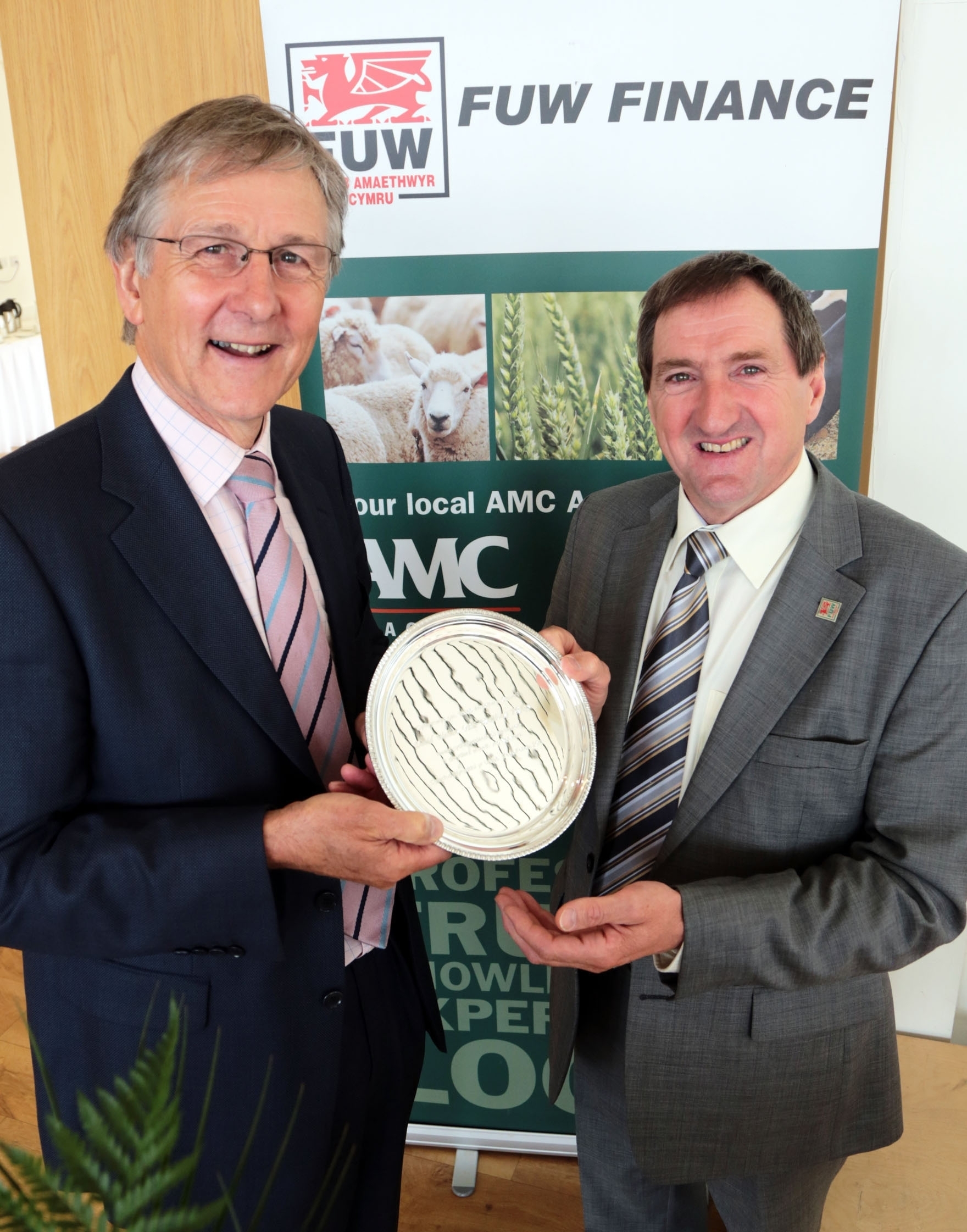 FUW AGM 1: David Walters (left) receives the FUW external award from Emyr Jones.