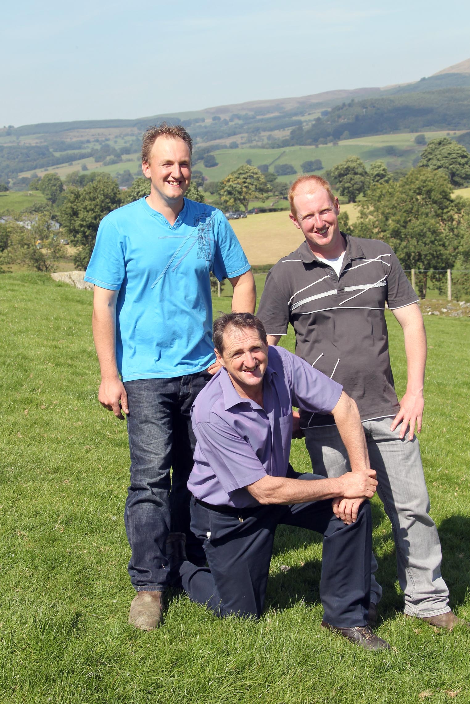 Emyr Jones (far right) on the family farm near Bala with his sons Dylan (left) and Aled.