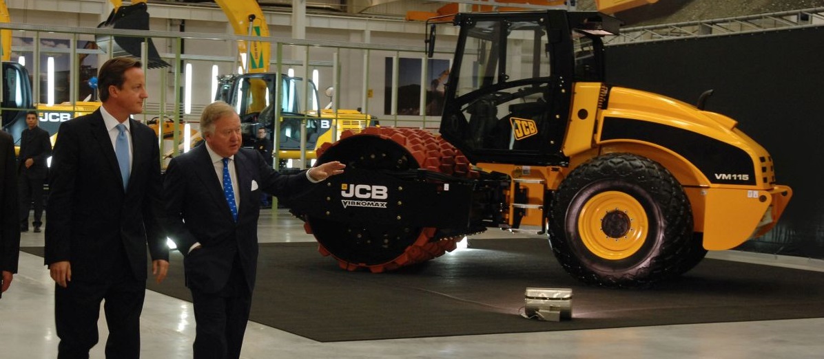 2013 - Sir Anthony shows David Cameron around the JCB Brazil factor