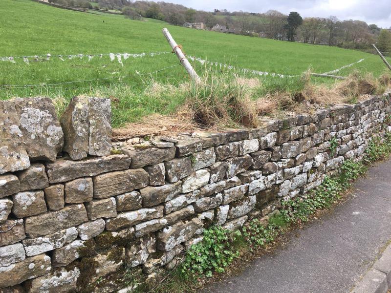 The dry stone wall from which the capstones were stolen (Photo: NYPolice)