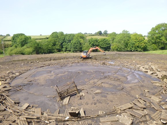 The cause was the 'catastrophic failure' of a 40-year-old slurry store, Natural Resources Wales said
