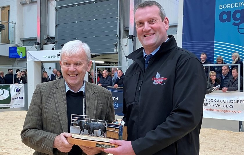 Last year's winner was Northumberland farmer George Neill (L)