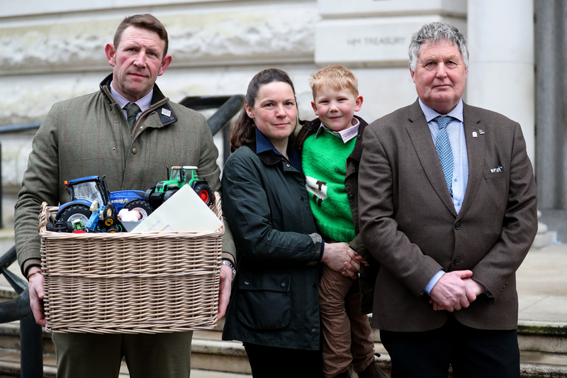 The Church family, who farm in Bedfordshire, handed the pre-loved toys over to the Treasury (Photo: NFU)