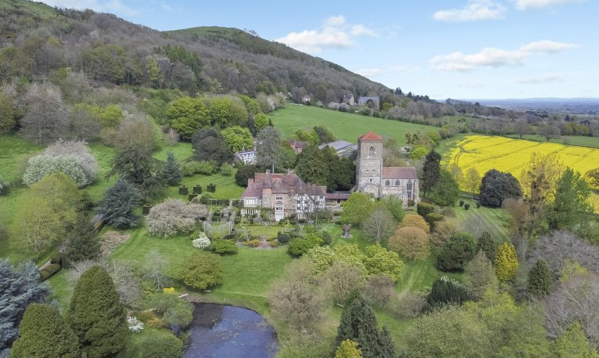 The property includes a Grade II Listed Priors Hall, which dates to around 1126